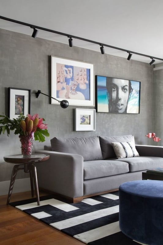 sala de estar moderna com parede cinza de cimento queimado