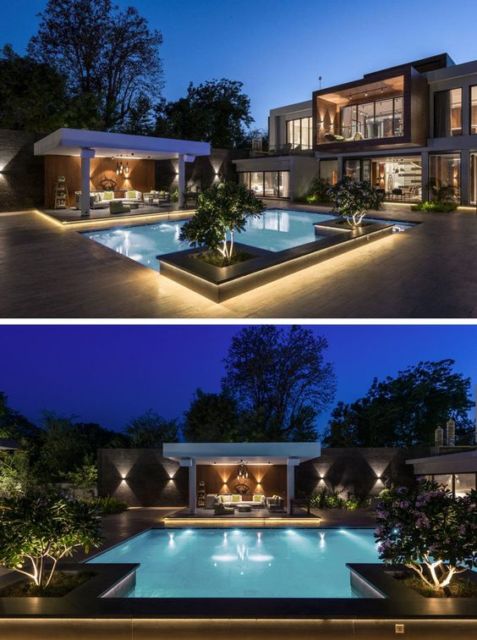 Casas com piscina: casa de luxo com jardim iluminado