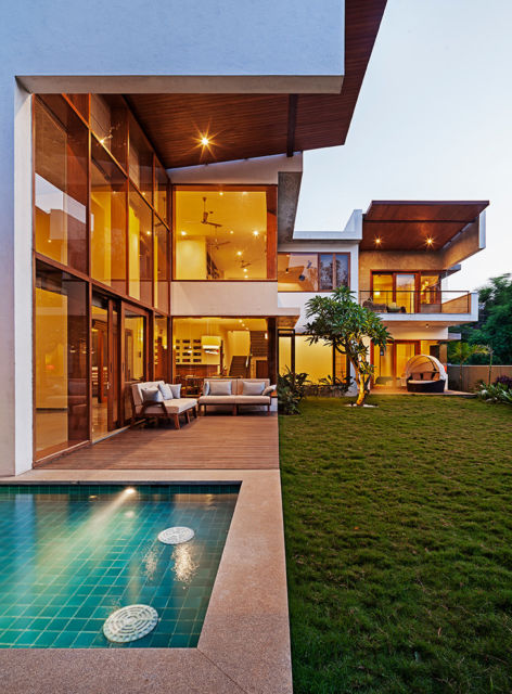 Casas em L: Com varanda