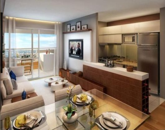 Sala moderna de TV com cozinha americana