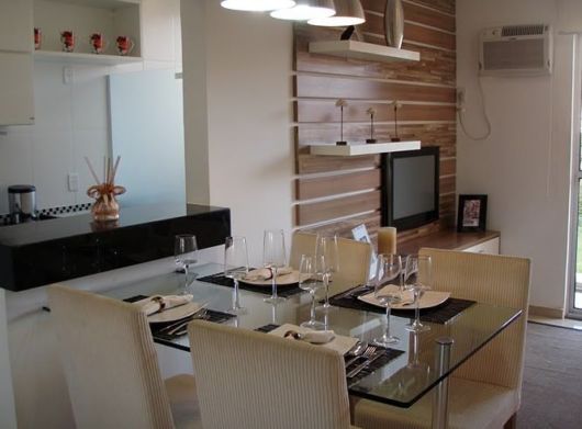 Veja ideia para uma sala com cozinha completa