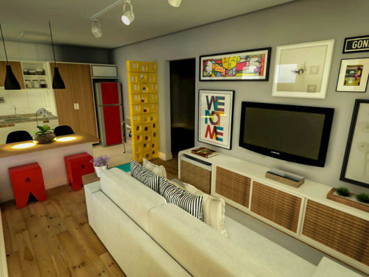 Sala de TV com cozinha americana colorida