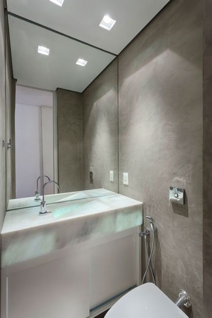 lavabo moderno com parede de cimento queimado