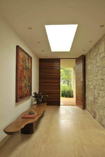 Hall de entrada: moderno com decoração rústica