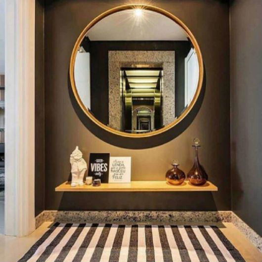 Hall de entrada: com espelho redondo