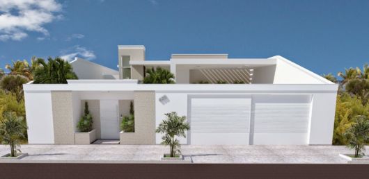 casa bege com branco com muro na frente.