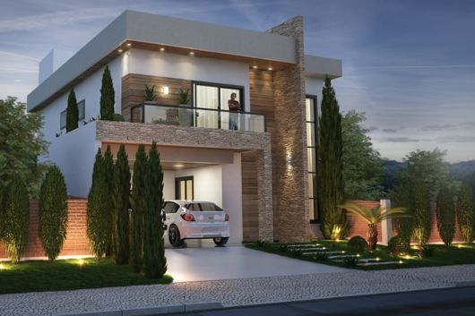 sobrado com sacadas de vidro.