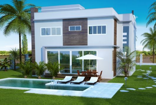 casa branca com varanda e piscina.