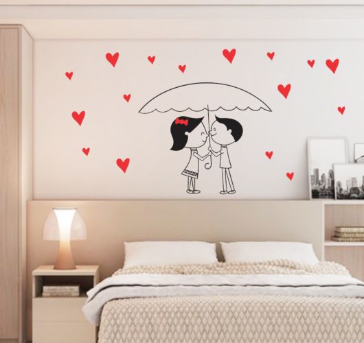 Enfeite de parede com desenho de casal.